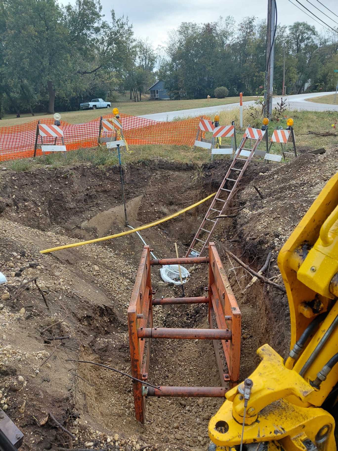 Major residential excavation job โ barricaded site with trench shoring